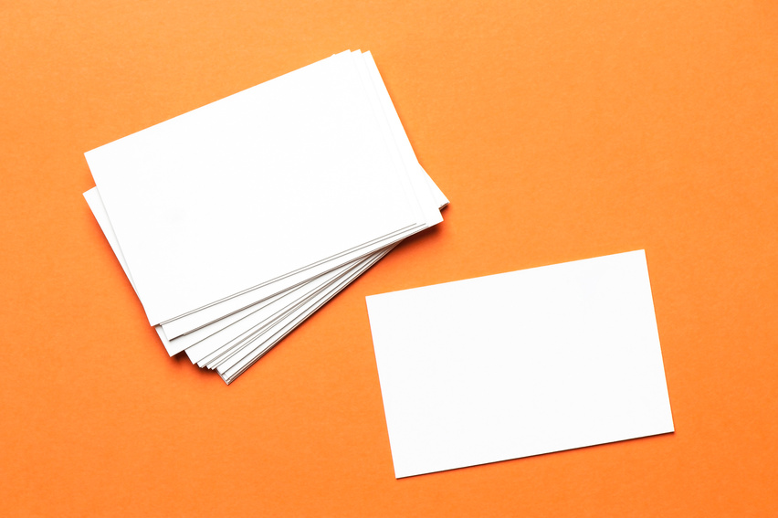 Pile of white notecards on an orange background